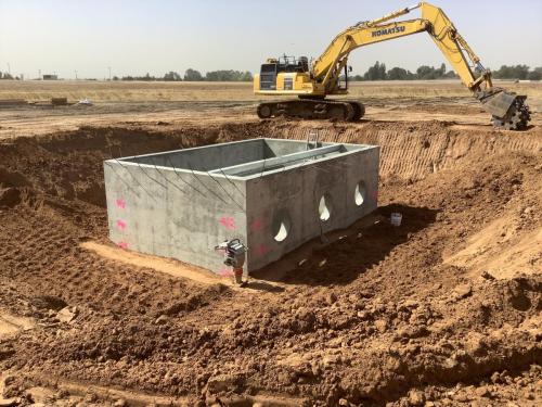Fancher Basin Pump Intake structure being backfilled with compacted soil