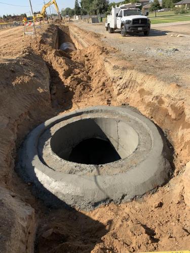 Manhole under construction in McCall Avenue north of McKinley Avenue, Sanger California